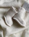 Raw Knitted Booties: Warmth and Care for the First Steps